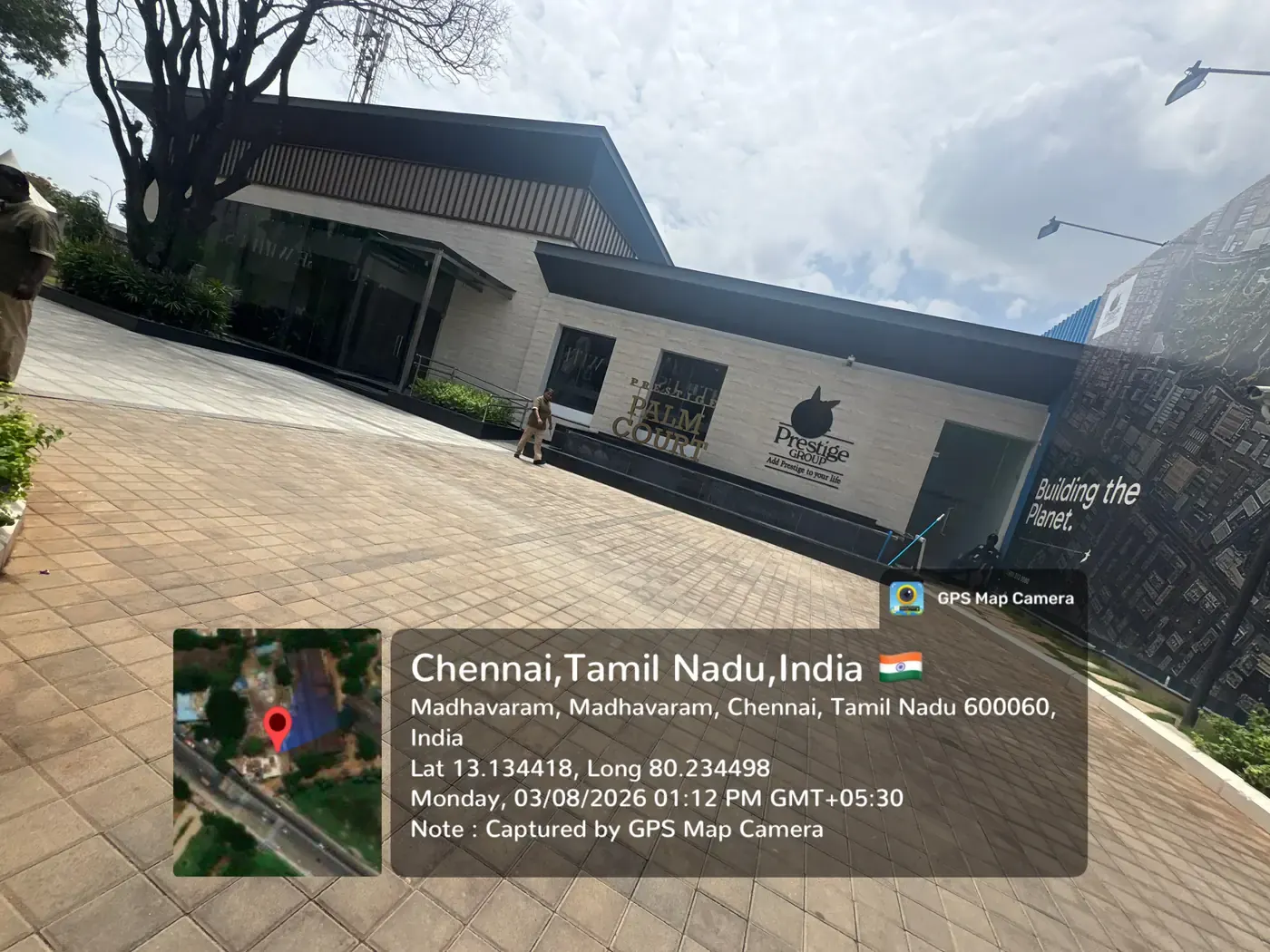 Prestige Palm Court on-site experience centre facade with project signage and landscaped forecourt, Madhavaram Chennai, August 2026