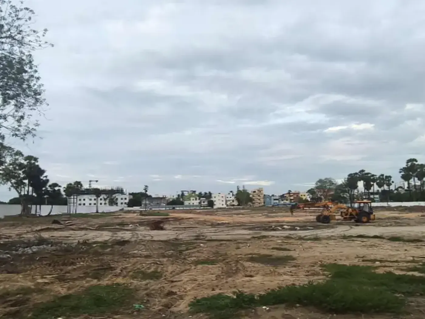 Cleared 7.98-acre Prestige Palm Court land with piling equipment on site, GPS-stamped Madhavaram North Chennai, August 2026